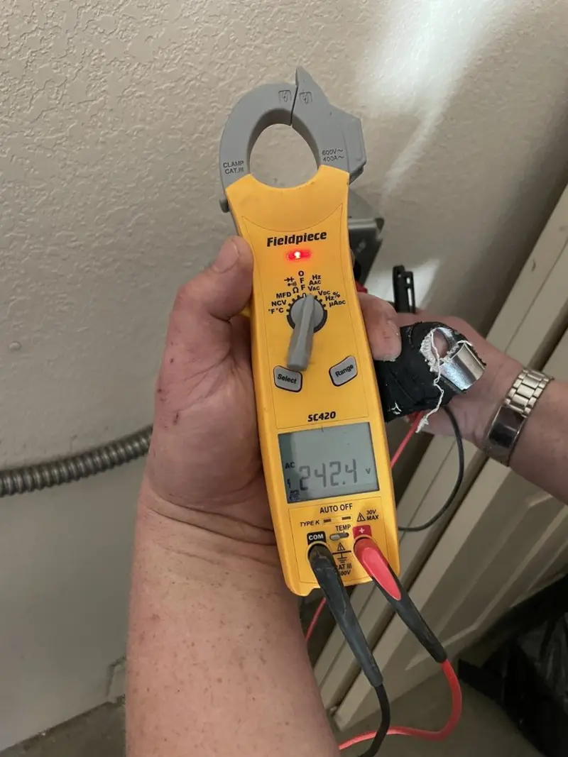 Voltage testing with clamp meter during Ceiling Fan Installation in Ranlo